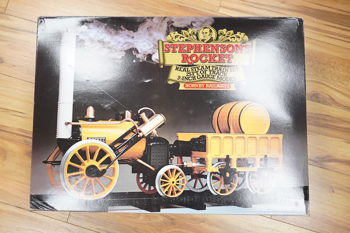 A boxed Hornby Railways 3.5 inch live steam Stephensons Rocket pack, comprising a two cylinder gas fired 0-2-2 Rocket and a quantity of plastic track sections